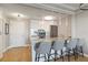 Bright kitchen with granite counters, stainless appliances, and barstool seating at 750 N Tamiami Trl # 1005, Sarasota, FL 34236