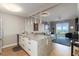 Modern living space with granite counters, pendant lighting, and water views at 750 N Tamiami Trl # 1005, Sarasota, FL 34236