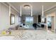 Open-concept living room with water views, modern furnishings, and pendant lighting at 750 N Tamiami Trl # 1005, Sarasota, FL 34236