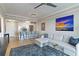 Open-concept living space with a modern kitchen, sleek furniture, and elegant decor at 750 N Tamiami Trl # 1005, Sarasota, FL 34236