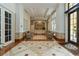 Grand lobby with tiled floor, seating, and front desk at the Renaissance at 750 N Tamiami Trl # 1005, Sarasota, FL 34236