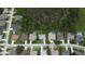Aerial shot of neighborhood homes each boasting well-maintained yards and screened in pools at 813 Oak Pond Dr, Osprey, FL 34229
