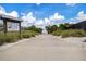 Picturesque beach access path with informational signs and lush greenery, inviting you to explore the shore at 813 Oak Pond Dr, Osprey, FL 34229