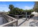 Beach boardwalk with shower and greenery at 813 Oak Pond Dr, Osprey, FL 34229