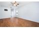 Bedroom featuring wood floors and a ceiling fan at 813 Oak Pond Dr, Osprey, FL 34229