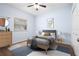 Bedroom featuring hard wood floors, modern décor, a ceiling fan and natural light at 813 Oak Pond Dr, Osprey, FL 34229