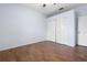Light blue bedroom with wood floors, a ceiling fan, and a double door closet at 813 Oak Pond Dr, Osprey, FL 34229
