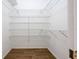 Closet features wire shelving and wood floors at 813 Oak Pond Dr, Osprey, FL 34229