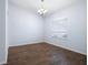 Clean dining room with wood floors and a window providing natural light at 813 Oak Pond Dr, Osprey, FL 34229