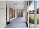 Screened-in back porch with a view of the backyard and pool area, and a ceiling fan at 813 Oak Pond Dr, Osprey, FL 34229