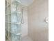Shower room featuring glass block privacy window and white wall tiles at 813 Oak Pond Dr, Osprey, FL 34229