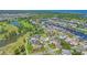 Aerial view of a waterfront community with canal access and lush landscaping at 815 Greenview Dr, Apollo Beach, FL 33572