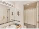 Well-lit bathroom with a modern mirror and a clean, functional layout, offering a comfortable and practical space at 815 Greenview Dr, Apollo Beach, FL 33572
