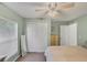 Bright and airy bedroom with ample closet space and a relaxing atmosphere, designed for comfort and tranquility at 815 Greenview Dr, Apollo Beach, FL 33572