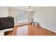 Spacious bedroom with wood floors, ceiling fan, and large window at 815 Greenview Dr, Apollo Beach, FL 33572