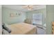 Charming bedroom with a soft, cozy bed and beach decor, creating a peaceful and inviting space for rest at 815 Greenview Dr, Apollo Beach, FL 33572