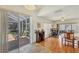 Open dining and office space with hardwood floors and sliding glass doors to the backyard at 815 Greenview Dr, Apollo Beach, FL 33572
