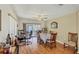 Inviting dining area boasts a table with seating, seamlessly flowing to a screened-in patio with natural light at 815 Greenview Dr, Apollo Beach, FL 33572