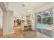 Kitchen with stainless steel appliances and a breakfast bar overlooking the pool at 815 Greenview Dr, Apollo Beach, FL 33572