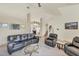 Large living room with cathedral ceilings, carpet and stairway access to the upper level at 815 Greenview Dr, Apollo Beach, FL 33572