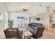 Bright and spacious living room with high ceilings, neutral walls, and a ceiling fan at 815 Greenview Dr, Apollo Beach, FL 33572