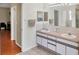 Bright main bathroom with double sinks, offering convenience and style with easy access to the bedroom at 815 Greenview Dr, Apollo Beach, FL 33572