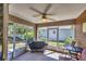 Cozy screened patio with a grill, perfect for outdoor dining and relaxation, offering serene views of the yard at 815 Greenview Dr, Apollo Beach, FL 33572