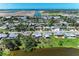 An aerial view of a quaint neighborhood, showing beautiful waterfront homes near a canal at 8321 43Rd Ave W, Bradenton, FL 34209