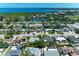 Aerial view of the neighborhood and property, with water views and lush landscaping at 8321 43Rd Ave W, Bradenton, FL 34209