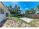 A grassy backyard features privacy fencing and a partially covered patio at 8321 43Rd Ave W, Bradenton, FL 34209