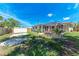 Well-sized, green backyard with a shed and screened in patio at 8321 43Rd Ave W, Bradenton, FL 34209