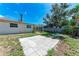 Backyard features open patio, mature trees and lawn at 8321 43Rd Ave W, Bradenton, FL 34209