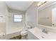 Bright bathroom with a tub and shower, decorative floors, and a single sink vanity at 8321 43Rd Ave W, Bradenton, FL 34209