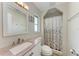 Well-lit bathroom featuring a decorative shower curtain and a sink with vanity at 8321 43Rd Ave W, Bradenton, FL 34209