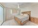 Spacious bedroom featuring a ceiling fan and a sliding glass door to the outside at 8321 43Rd Ave W, Bradenton, FL 34209