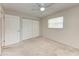 Carpeted bedroom with ceiling fan, closet, and a window at 8321 43Rd Ave W, Bradenton, FL 34209