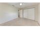 Neutral carpeted bedroom featuring a ceiling fan, and double closet with doors at 8321 43Rd Ave W, Bradenton, FL 34209