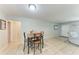 Open dining room featuring tile flooring and seamlessly connected with the living area at 8321 43Rd Ave W, Bradenton, FL 34209