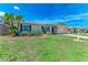 Charming single-story home with a well-maintained lawn and beautiful, mature landscaping at 8321 43Rd Ave W, Bradenton, FL 34209