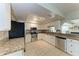 Well-lit kitchen featuring granite countertops, stainless steel appliances, and white cabinetry at 8321 43Rd Ave W, Bradenton, FL 34209