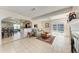Bright living room with tile floors, fireplace, and sliding glass doors to the outdoor patio at 8321 43Rd Ave W, Bradenton, FL 34209