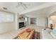 Inviting living room boasts tile flooring, fireplace and sliding doors for natural light at 8321 43Rd Ave W, Bradenton, FL 34209
