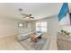 Comfortable living room featuring tile flooring, modern furniture, and lots of natural light at 8321 43Rd Ave W, Bradenton, FL 34209