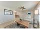 Comfortable living room featuring tile flooring, a ceiling fan, and contemporary decor at 8321 43Rd Ave W, Bradenton, FL 34209