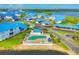 Aerial view of community featuring a pool, spa, and serene water at 840 Audubon Dr, Bradenton, FL 34209