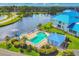 Aerial view of community pool and spa surrounded by lush landscaping at 840 Audubon Dr, Bradenton, FL 34209