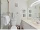 Clean bathroom with a walk-in shower, toilet, and vanity with a mirror at 840 Audubon Dr, Bradenton, FL 34209