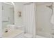 Bright bathroom featuring a shower/tub combo and a vanity with towels at 840 Audubon Dr, Bradenton, FL 34209