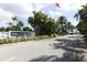 Perico Bay Club entrance featuring lush landscaping, signage and manicured grounds at 840 Audubon Dr, Bradenton, FL 34209