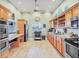 Spacious community kitchen features ample counter space, stainless steel appliances, and modern flooring at 840 Audubon Dr, Bradenton, FL 34209